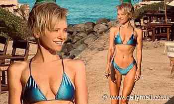 Ex-Neighbours star Nicky Whelan shows off her impossibly tiny waist