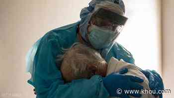 Houston doctor shown hugging distraught COVID-19 patient in ICU in now viral photo - KHOU.com