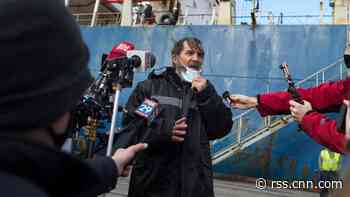 The man who was found clinging to his boat in Florida is safely on shore and heading home