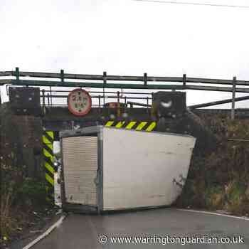 Van gets stuck under railway bridge on Alder Root Lane