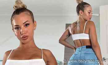 Fitness sensation and mother-of-two Tammy Hembrow, 26, flaunts her curves in new TINY denim shorts