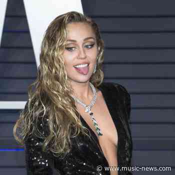 Miley Cyrus bares her breasts for Rolling Stone