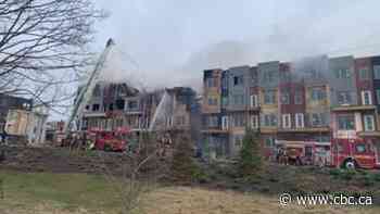 Toronto firefighters battle 3-alarm fire in unoccupied townhouses near Downsview Park