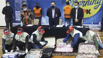 Indonesia minister surrenders to authorities over Covid-19 aid bribe charges