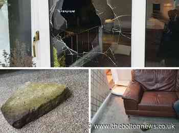 Yob hurls large rock through window of Bolton home