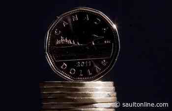 North American stock markets down in early trading, loonie climbs higher