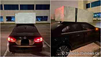 Ontario driver caught using only tape to attach 'massive' dresser to his car roof: police