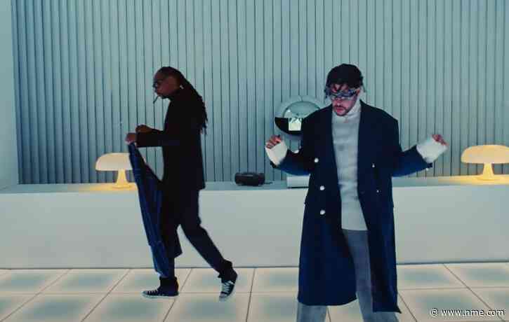 Watch Bad Bunny journey through the desert to a menswear shop in ‘Hoy Cobré’ video