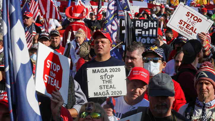 Biden ‘will be removed one way or another’: Alex Jones, Michael Flynn speak at pro-Trump march as rival protesters clash (VIDEOS)