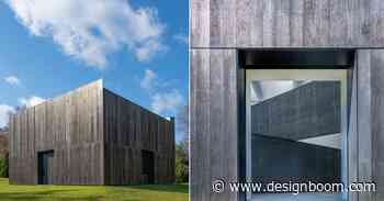 OLI architecture sets richard serra's london cross sculpture in charred wood pavilion in NY - Designboom