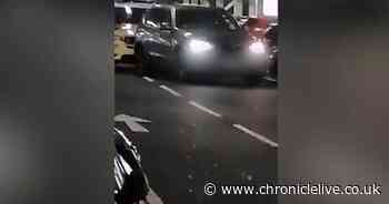 Armed police descend on a Tesco car park to arrest two suspects