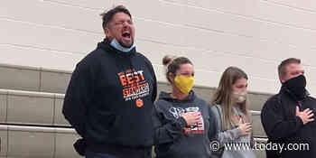 Dad sings rousing national anthem from the stands after gym's sound system fails