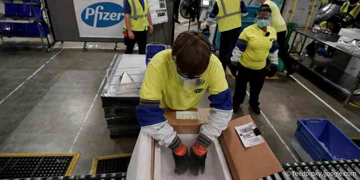 Photos show the COVID-19 vaccine packaging, loading, and shipping process at Pfizer's Michigan facility