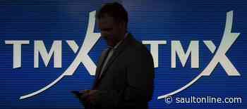 North American stock markets up in early trading, loonie continues climb