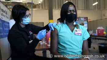 US Covid-19 deaths top 300,000 just as vaccinations begin