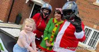 Motorbike Santa delivers Christmas presents to struggling families