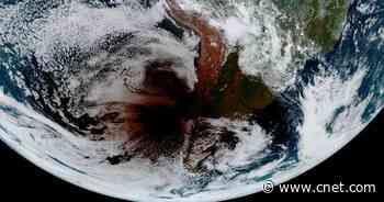 Space view shows a moon shadow on Earth during Monday's solar eclipse     - CNET