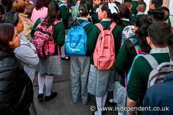 School girls lined up on knees in ‘patriarchal’ skirt length check