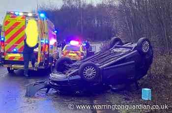 Car overturns on M6 slip road after crash near Lymm