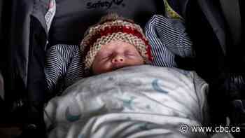 B.C. mother who gave birth while in a coma due to COVID-19 is awake, meets baby for first time