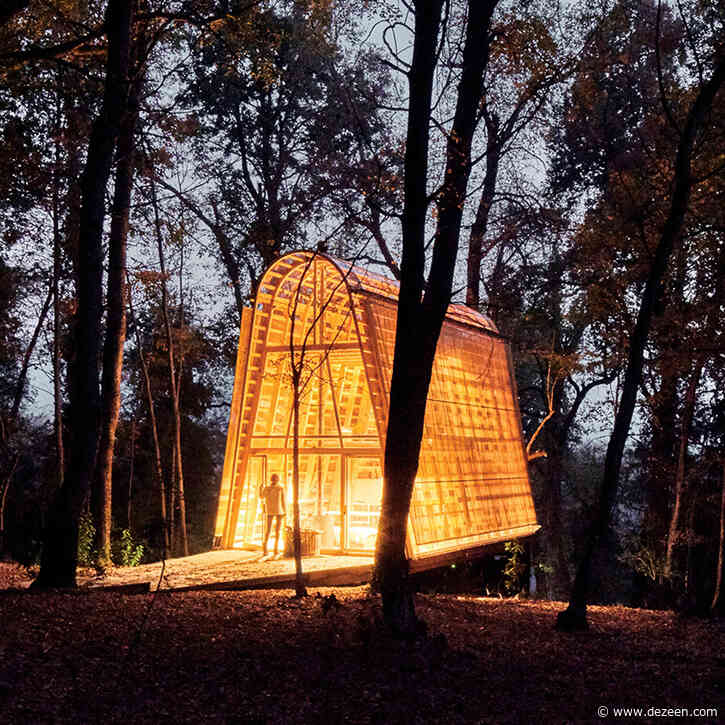 Small La Invernada house glows in Chilean forest at night