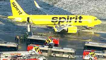 US snowstorm: Plane skids after landing in icy conditions at Baltimore airport