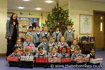 Children at Bolton School's Beech House  ensure those less fortunate wake up to a gift on Christmas morning