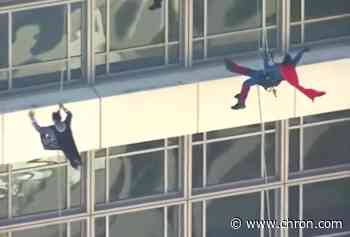 Batman and Superman surprise young cancer patients at Texas MD Anderson Center in Houston