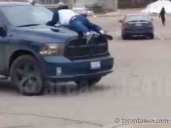 WATCH: Man clings to hood of truck following dispute over Toronto parking job - Toronto Sun