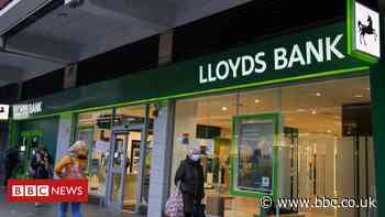 Lloyds Banking Group cancels bonuses after profit drop