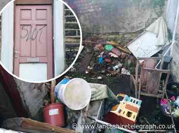 Problem house becomes eyesore after offensive slur is painted on front door