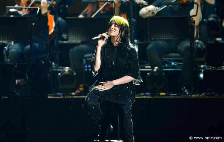 Billie Eilish says the mixed reaction to her ‘No Time To Die’ theme song announcement was “rough”