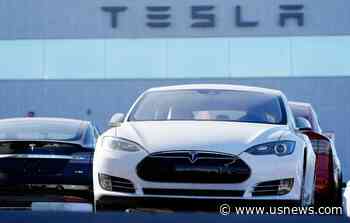 High-Flying Tesla Stock Takes a Hit on 1st Day in S&P 500