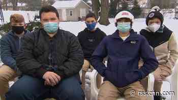 Five high school freshman are being called heroes for saving two children from an icy pond