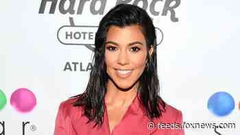 Kourtney Kardashian rocks festive outfit: 'My presence is a present'