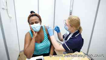 UK faces race between vaccine rollout and virus mutations, scientists say