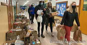 St. Paul teachers and neighbors deliver groceries and holiday cheer to families in need