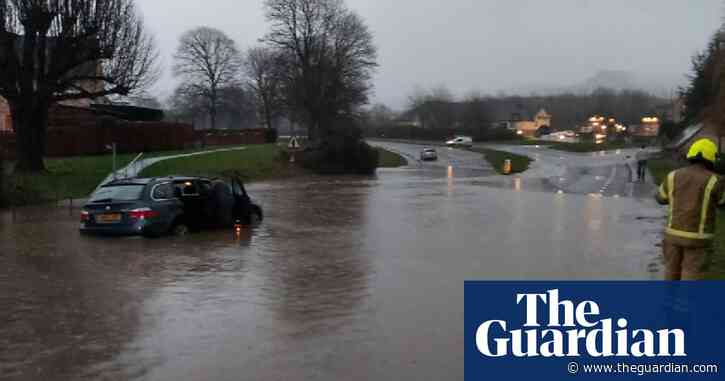 UK weather: flood alerts in England and Wales after heavy rain