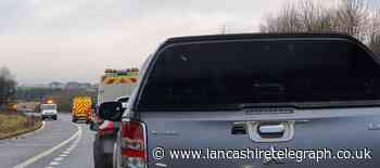 M65 closed as car crashes into barrier causing delays and congestion