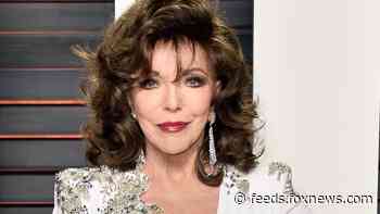 Joan Collins, 87, stuns in low-cut red dress in throwback Playboy cover