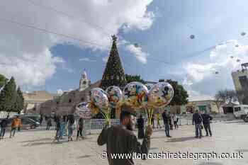In Pictures: Christmas gets under way around the world after year of trials