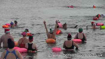 Sea swimmers take to the water on Christmas Day