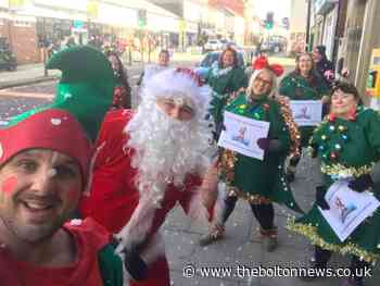 Santa pulls on walking boots to raise cash for Bolton Hospice - The Bolton News
