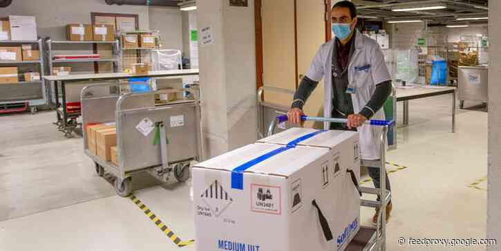 Photos show vaccines arriving at hospitals across Europe, after regulators finally approved the Pfizer shot