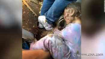 Watch moment police find crying child underneath rubble of a home blast