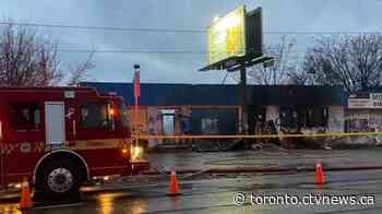 Fire crews remain on scene of massive fire at vacant building in Toronto's west end