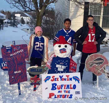 Buffalo Bills fans make use of the snowfall to display their support for the team