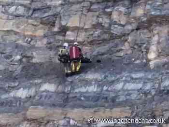 Hiker rescued after surviving 100ft drop from mountain