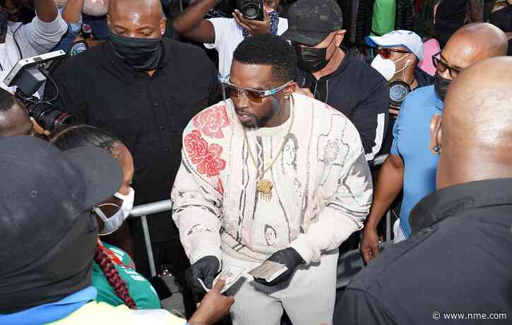 Diddy hands out cash and gift cards in Miami to help US residents during the COVID-19 pandemic