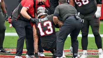 Bucs' Evans hurts knee a play after setting mark